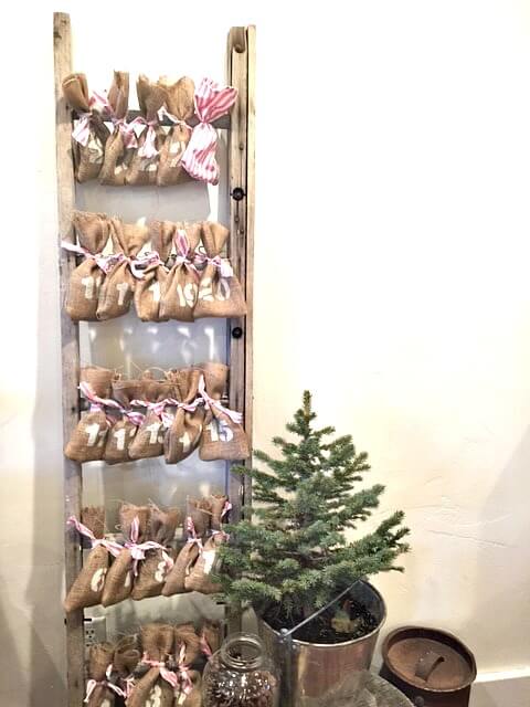 Reusable advent calendar with a ladder and burlap!