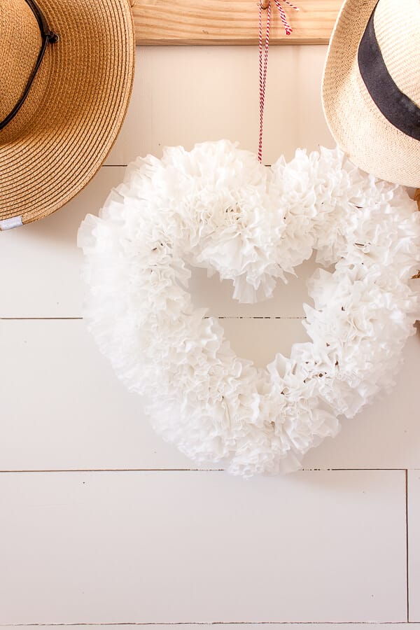 Make this super easy coffee filter wreath for Valentines day, even if you hate to decorate!  This is an easy way to add a bit of festive Valentines Day decor to your home.