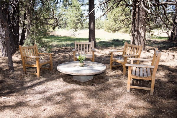 Seating area for an outdoor woodland wedding.