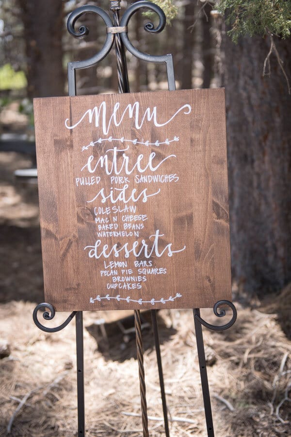 What a creative way to display the menu at an outdoor woodland wedding. Beautiful.