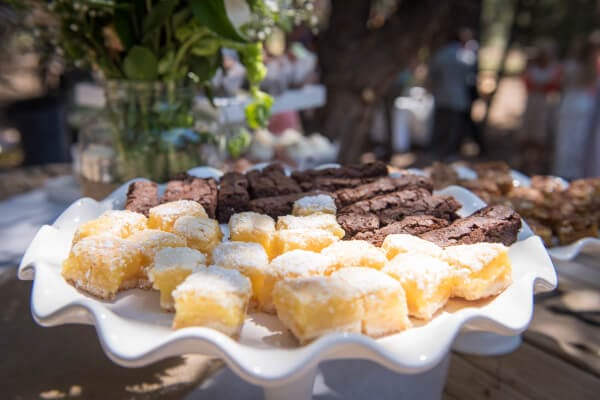 This outdoor woodland themed wedding was perfect. They displayed their desserts on an old wire spool. The rustic wood with the delicate ceramic serve ware is perfect.