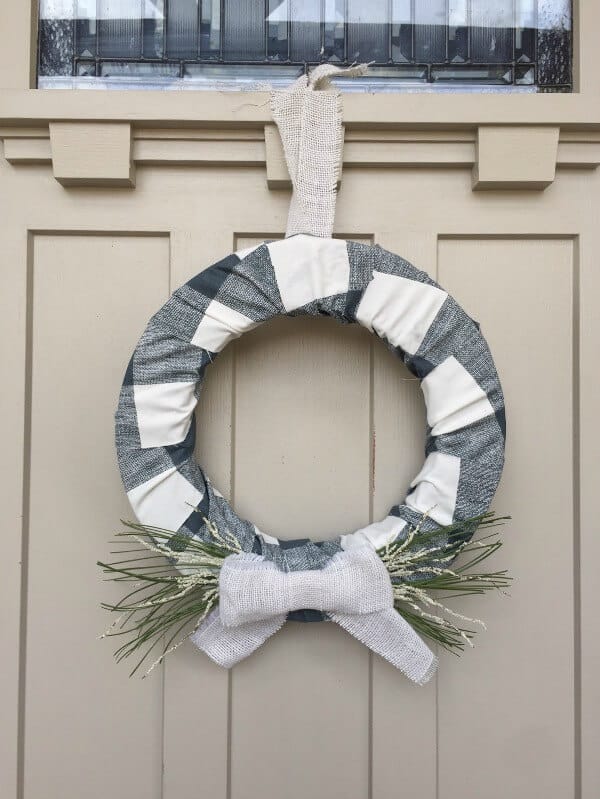 This farmhouse style buffalo check holiday wreath is the prefect addition to your decor this Christmas!