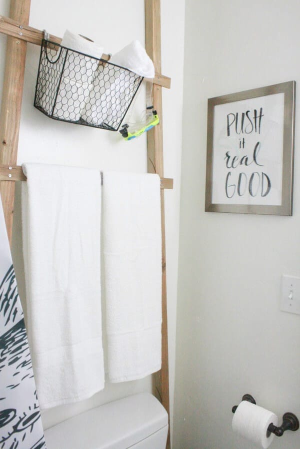 My kids love this hilarious artwork in this budget friendly bathroom makeover!