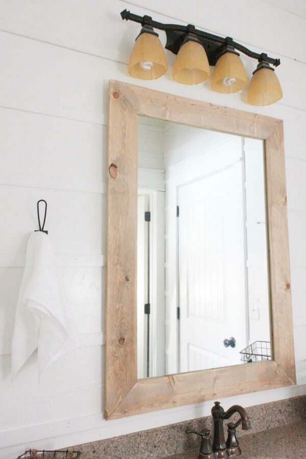 A simple farmhouse hook is the perfect addition in this budget friendly bathroom makeover. Did I mention it was done for under $100 dollars?