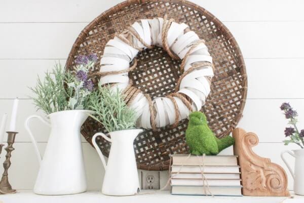 Its time to clean out the winter and decorate! Check out this farmhouse spring mantel! It is sure to inspire you to decorate your home for spring!