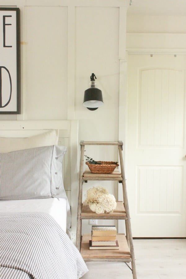 Farmhouse Master Bedroom | ladder night stand | neutral decor | farmhouse decor | swing arm lamps | ticking stripe