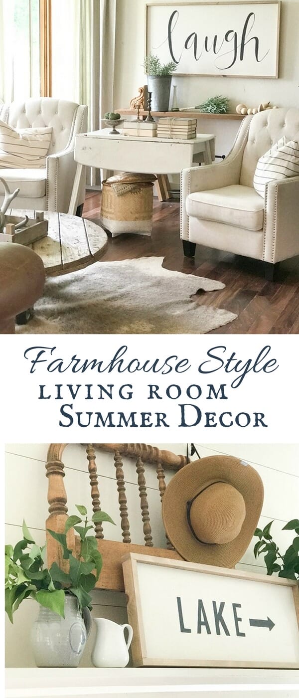Farmhouse living room summer decor complete with large farmhouse signs, pottery, rustic wood, and fresh lilac cuttings. A touch of navy blue accents finishes off the space.