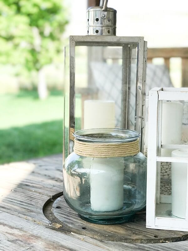 Simple lanterns make a great outdoor centerpiece filled with candles. Imagine how lovely at night!