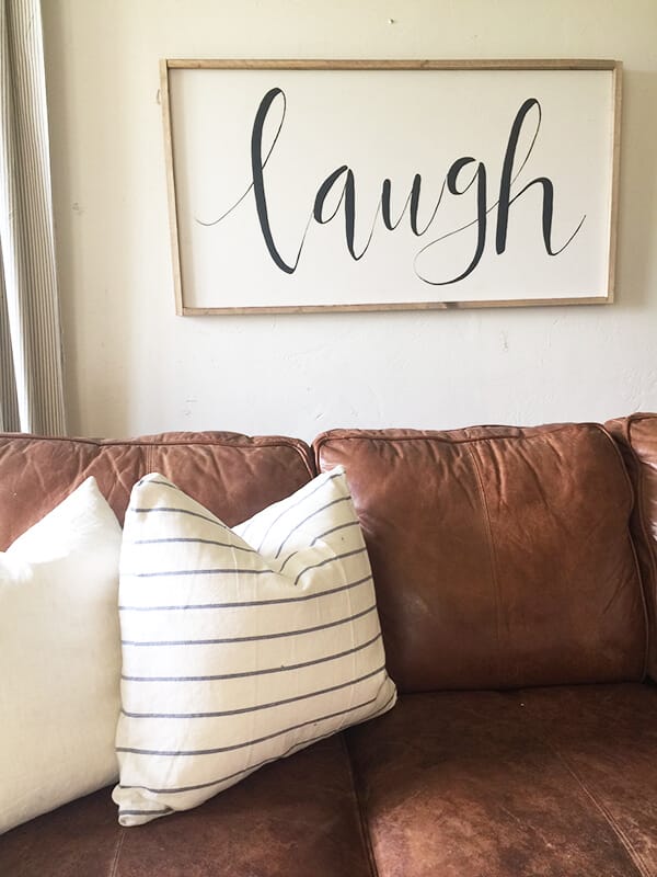 Add farmhouse style to your home with this easy DIY large farmhouse sign. Its simple, clean lines would fit in any decor!