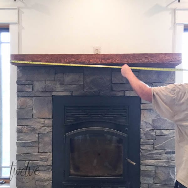 You have to see how they transformed this stone firepalce surround into a farmhouse style stacked stone fireplace. Love the shiplap accents and the handmade corbels!