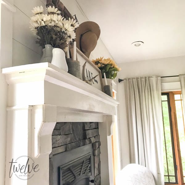 You have to see how they transformed this stone fireplace surround into a farmhouse style stacked stone fireplace. Love the shiplap accents and the handmade corbels!