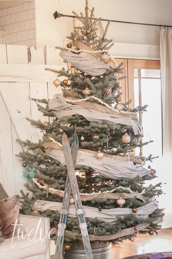 Ticking stripe fabric, linen ribbon, popcorn garland, all thrown together to create an amazing farmhouse style Christmas tree.