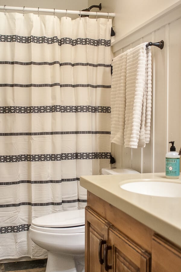 New towels, a new white and black tribal inspired shower curtain, and a few other simple bathroom decor ideas can completely transform a space.