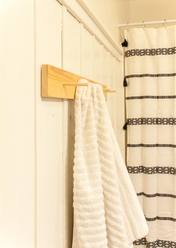 Create an easy DIY peg towel rack to hang your towels on!