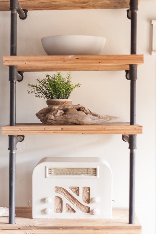 Combine different textures and heights to create beautifully designed decorative wall shelves. 