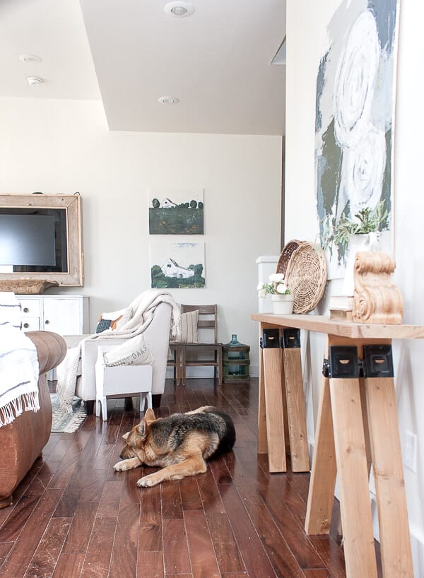 Beautiful space and that dog! Love the landscape art and calm feel to the space.