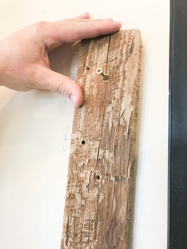 Use wood blacks to attach a TV frame to the wall