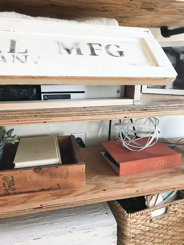 Using an old crate to hide ugly electronics is such a genius idea!
