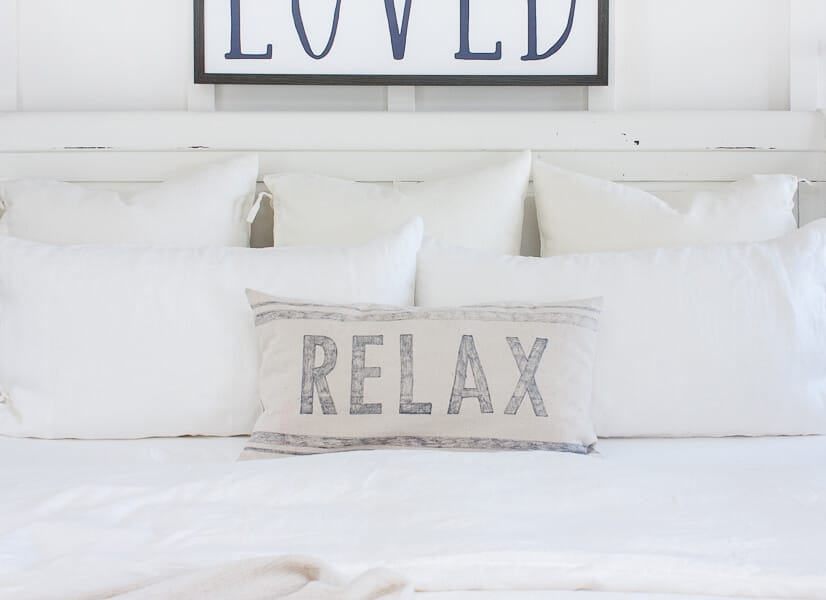 I love this bed and those bed pillows dressed in white linen bedding!