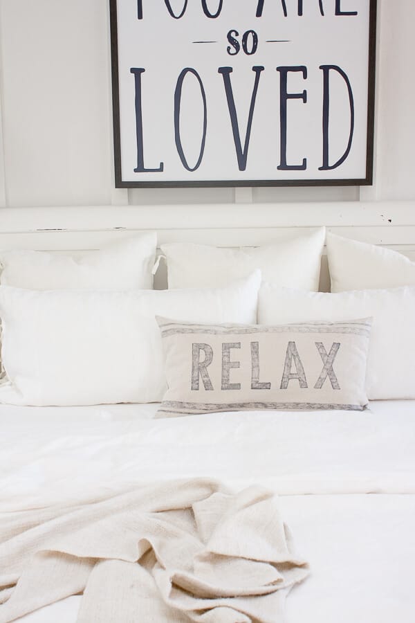 Farmhouse style white linen bedding from IKEA and the best way to keep your bed pillows looking like new!