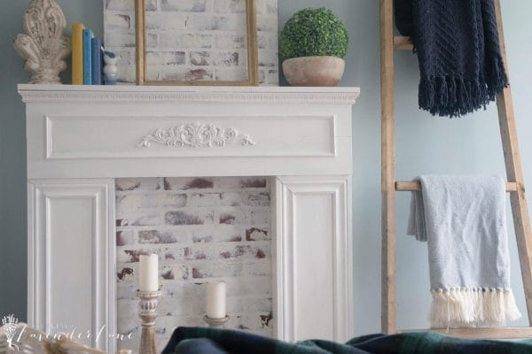 Super sweet DIY faux fireplace with brick insert