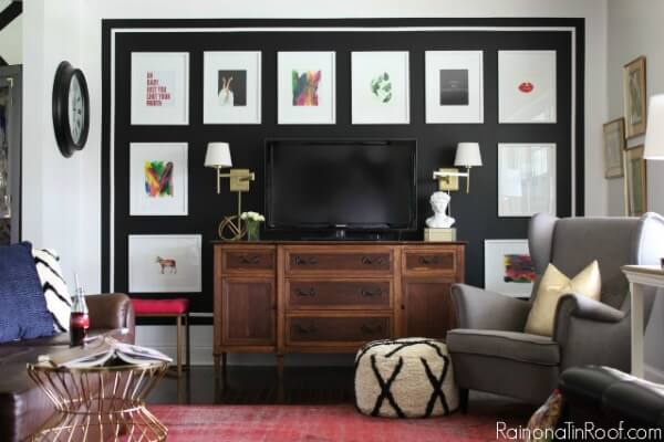 Decorate around a TV with a black accent wall!