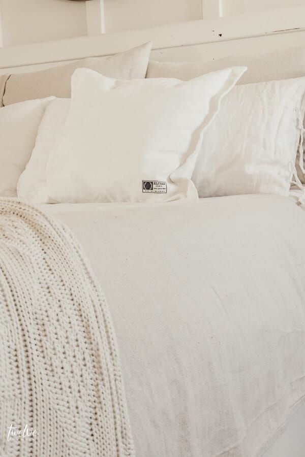 Get farmhouse bedding for practically nothing with this easy bedding hack!