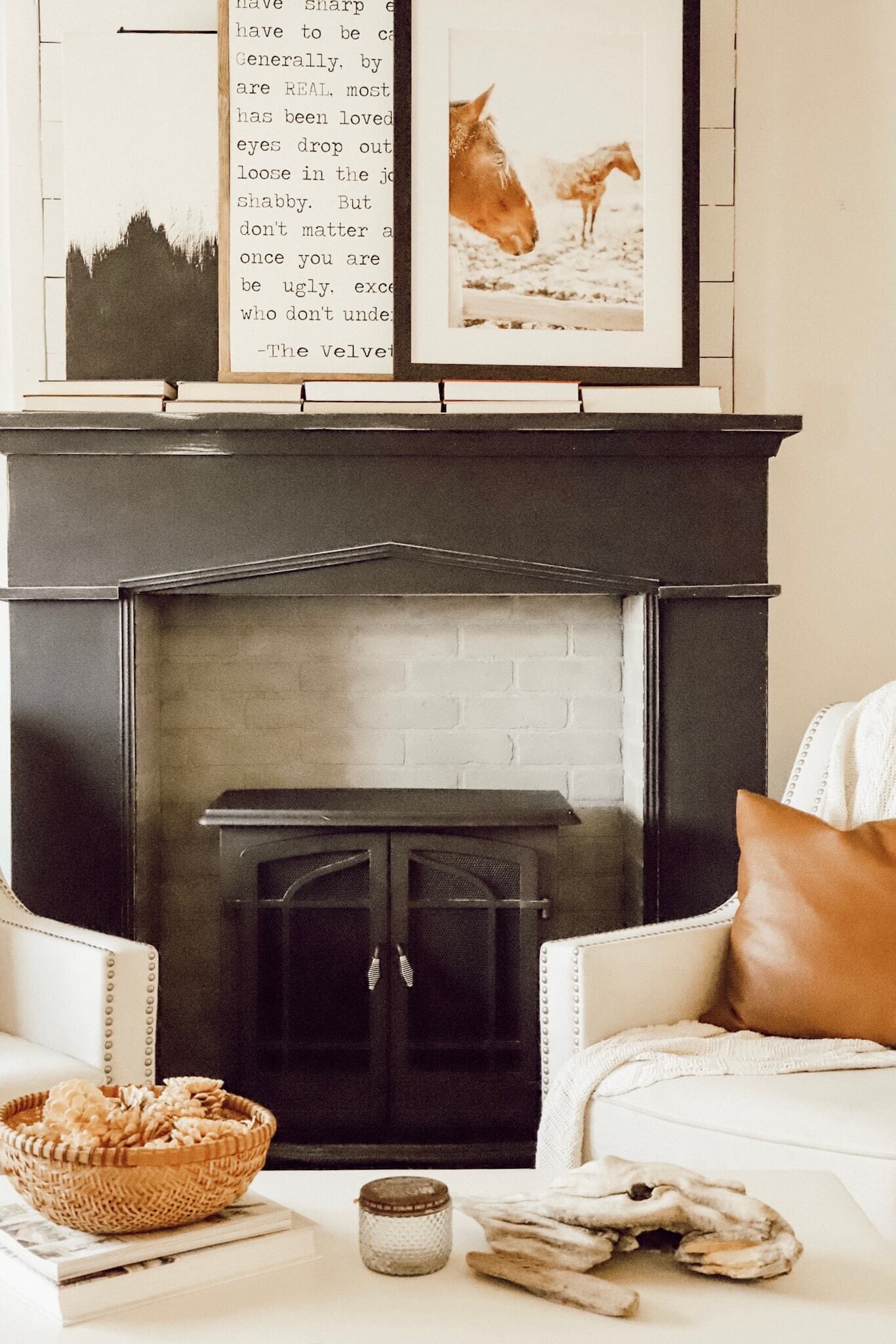 We updated out fireplace! Introducing our new painted fireplace in black! Such a showstopper!