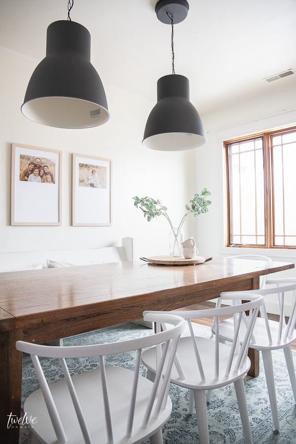 I am obsessed with these IKEA Hektar lights, and the custom framed artwork in this modern farmhouse dining room design!