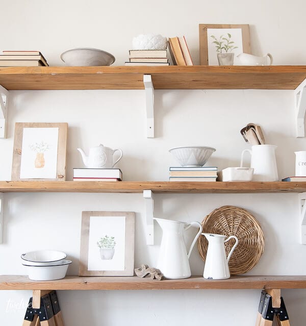 Gorgeous styled shelves full of modern farmhouse decor and adorable watercolor spring printables that are available for FREE here!