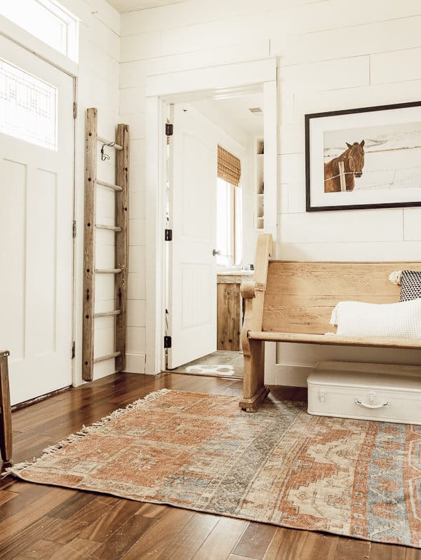 Simple farmhouse spring entryway, with minimal touches. I love this.