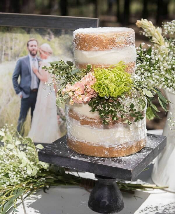 Outdoor naked wedding cake with flowers