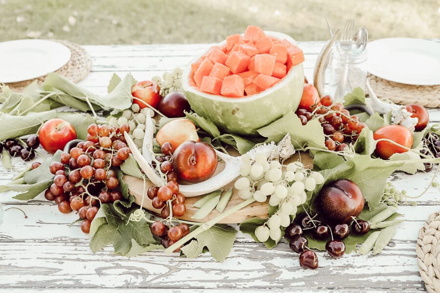 Enjoy your summer with a gorgeous and delicious edible summer tablescape.  Check out all these great ideas!