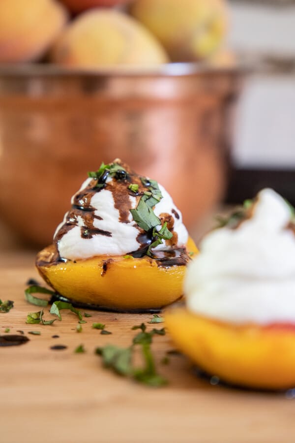 Try this delicious roasted peach dessert. With the combination of cheesecake mousse, basil and balsamic reduction this dessert screams eat me!