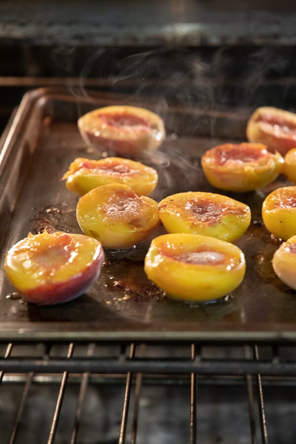 roasted peaches in the over for a decadent peach dessert