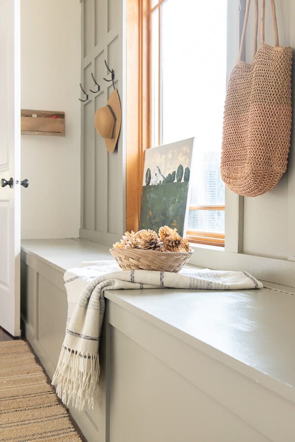 Mudroom decor ideas and mudroom design ideas that are easy and functional! Check out this mudroom bench with storage. It hides all out ugly stuff, allowing us to still enjoy the space.
