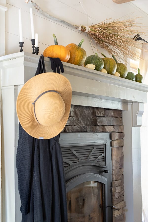 A very fun and stylish witch inspired Halloween mantel. Find a place to park your broom, hang your cloak and riding gloves and sit down and take a spell!