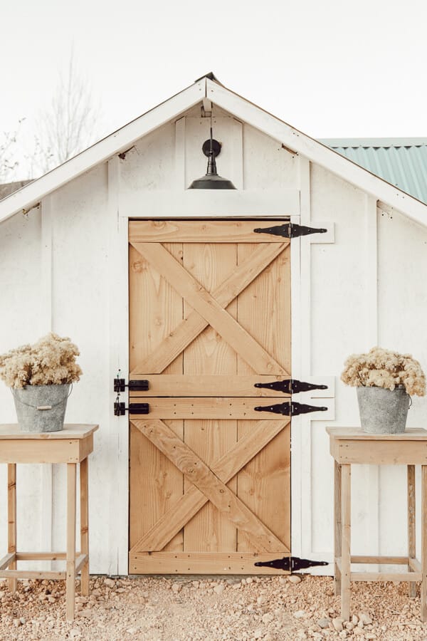 This chicken coop design is beautiful and functional! Love this dutch door and and you believe that light is solar charged? Gorgeous!