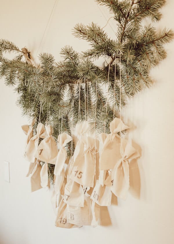Cute Scandinavian inspired advent calendar with muslin bags and a tree branch!