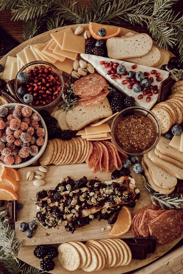 How to make a gorgeous holiday charcuterie board that is delicious and full of texture and style. Take a simple meat and cheese plate and turn it on its head!