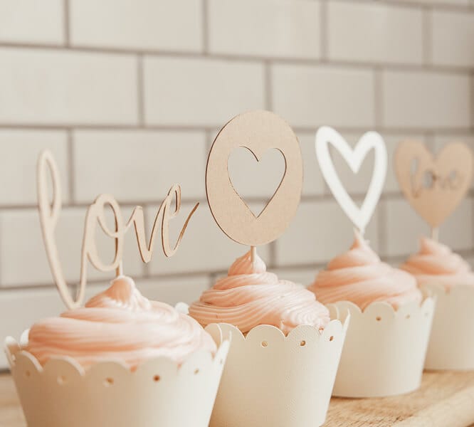 Super adorable Valentines cupcake ideas to make your family swoon!  Fun DIY homemade cupcake toppers using a Cricut, as well as make your own cupcake wrappers!
