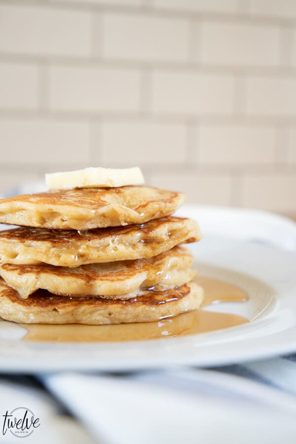 How to make light and fluffy whole wheat pancakes using your blender! These are the yummiest whole wheat pancakes, with a sweet nutty wheat flavor, and a light and fluffy texture.