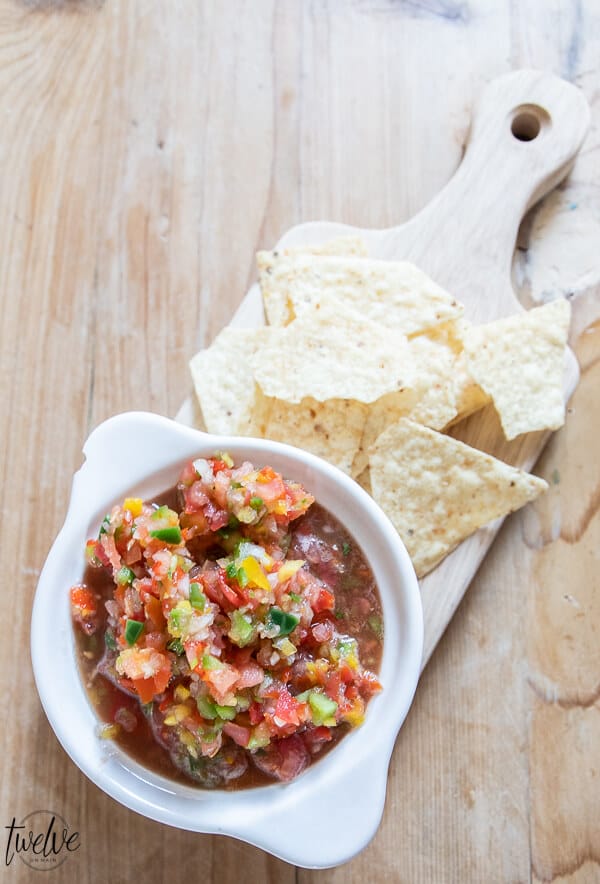 Get this zesty fresh salsa recipe now!  Makes the most amazing nachos, perfect on eggs and breakfast burritos, and killer on tacos.  Make it now!