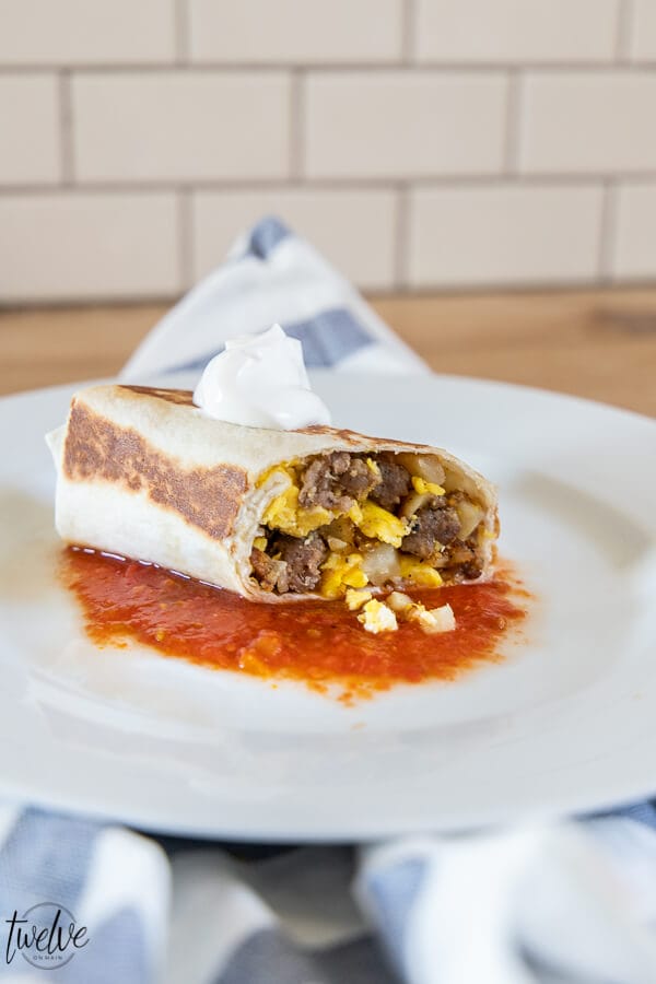 Super easy and super tasty egg, sausage, and potatoe breakfast burrito recipe. This is one of our favorites, makes enough for leftovers and is a hit!