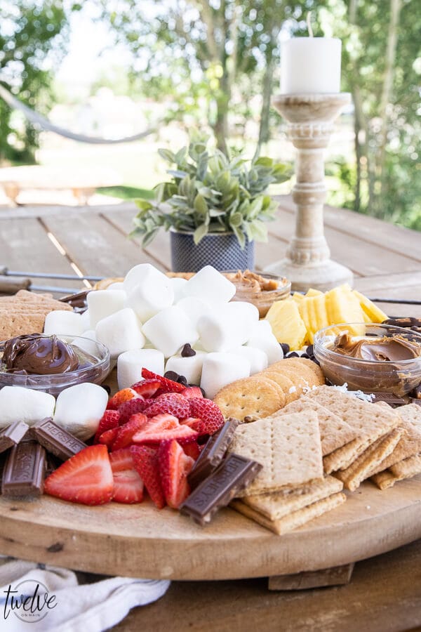 Make a fun s'mores board  that is perfect for entertaining a group or for simple night with the family. This s'mores bar gives everyone options and makes it easy to make any kind of s'mores you can dream of!