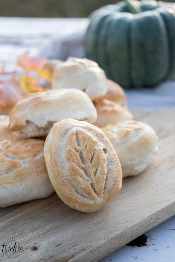 Up your fall game by serving these gorgeous fall inspired dinner rolls with a leaf cut design! This only takes about 5 minutes and you can use frozen pre-made dough or your own favorite dinner roll recipe to make them! You only need one special tool to do it!