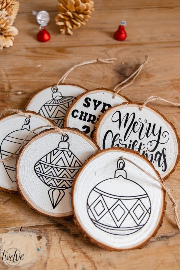 These handmade Christmas ornaments are the perfect gift to give to family and friends! Make them easily with wood rounds and cut the designs on the Cricut Maker. Don't have one? Let me tell you why you should get one!