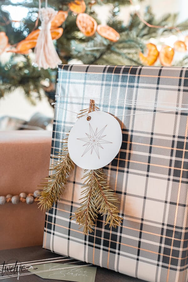 Holiday gift wrapping ideas using craft paper, combining patterns, using unusual items as accents, and FREE printable gift tags!
