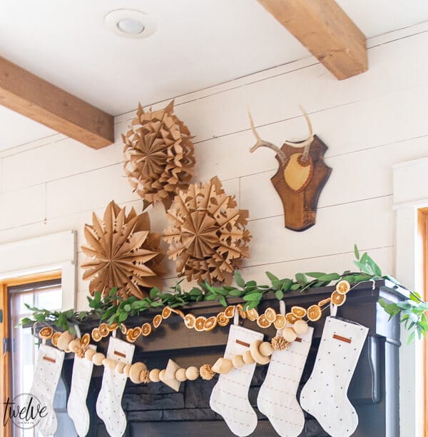 How to make gorgeous large or small paper bag snowflakes! These are so cool and make a big statement in your house. They are inexpensive too!