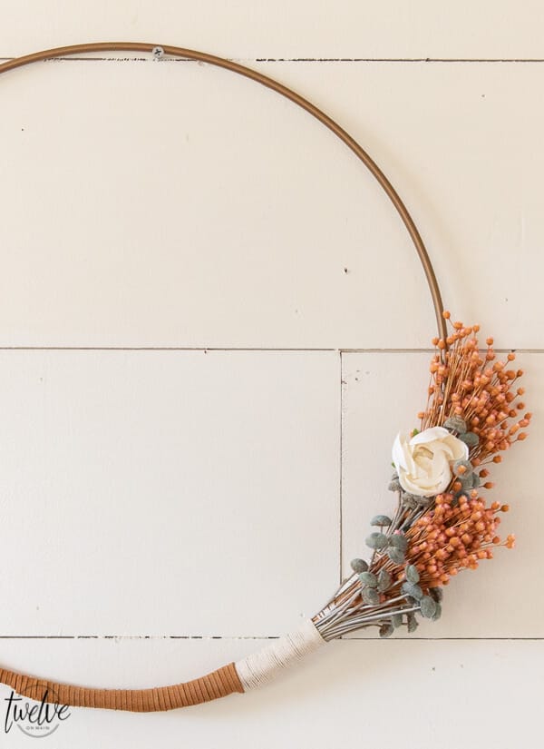 Gorgeous boho style hoop wreath for spring! This has beautiful dried flowers, twine and leather accents and will work in your home for more than just the spring season.